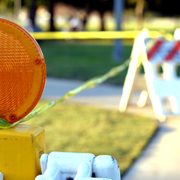 Closeup of a barricade with caution tape.