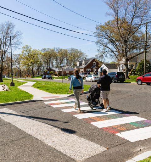 couple walking on crosswalk